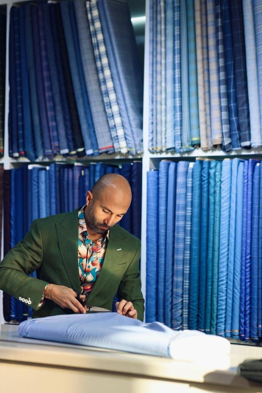 Cutting cloth at the showroom